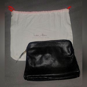 India Hicks leather clutch